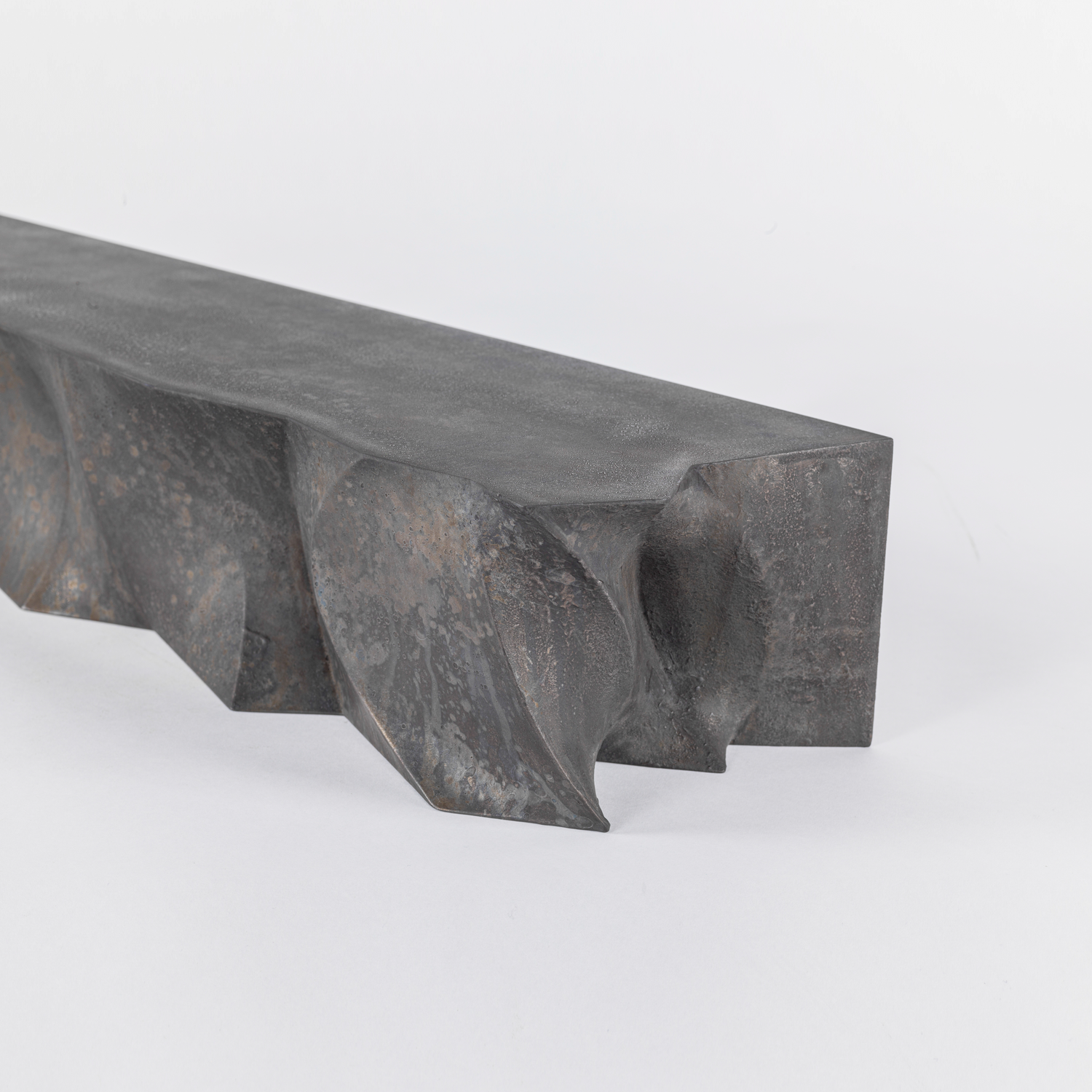 Brutalist inspired sculptural floating shelf coated in patinated manganese